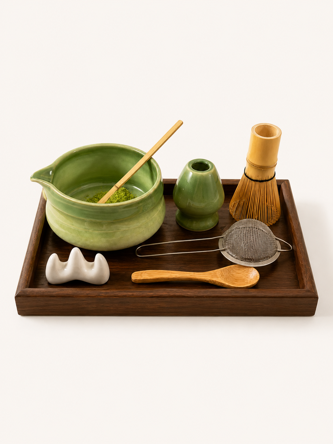 Ceremonial matcha set — bamboo whisk, chawan bowl, and stone scoop